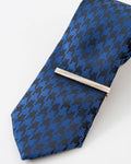 Blue textured formal tie with gold tie clip