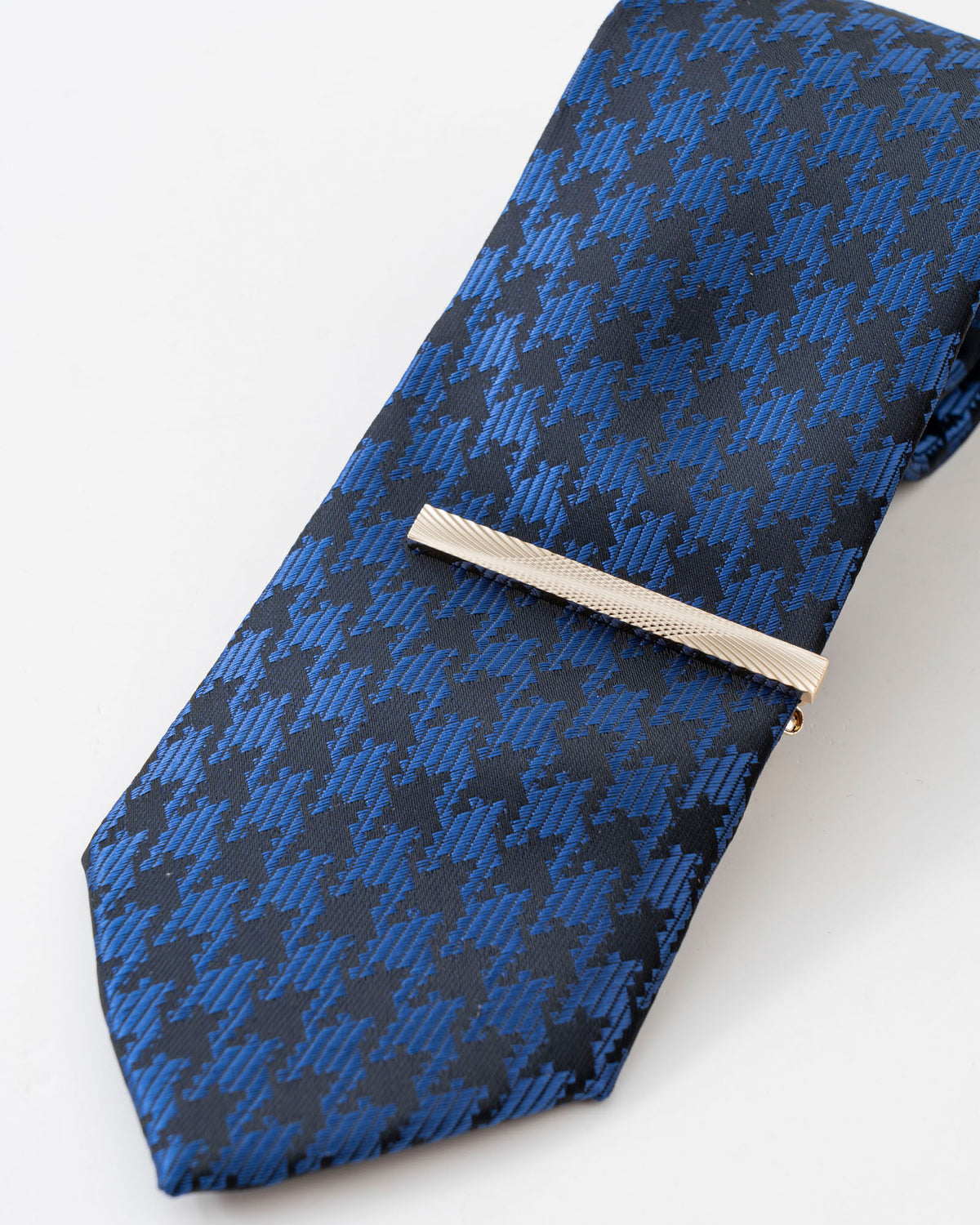 Blue textured formal tie with gold tie clip