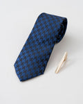 Gold-tone tie clip close-up