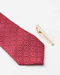 Textured gold-tone tie clip close-up