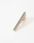 Black stripe gold-tone tie clip styled with a patterned tie