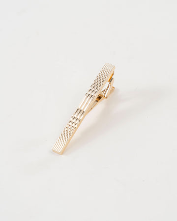 Diamond-textured tie clip close-up