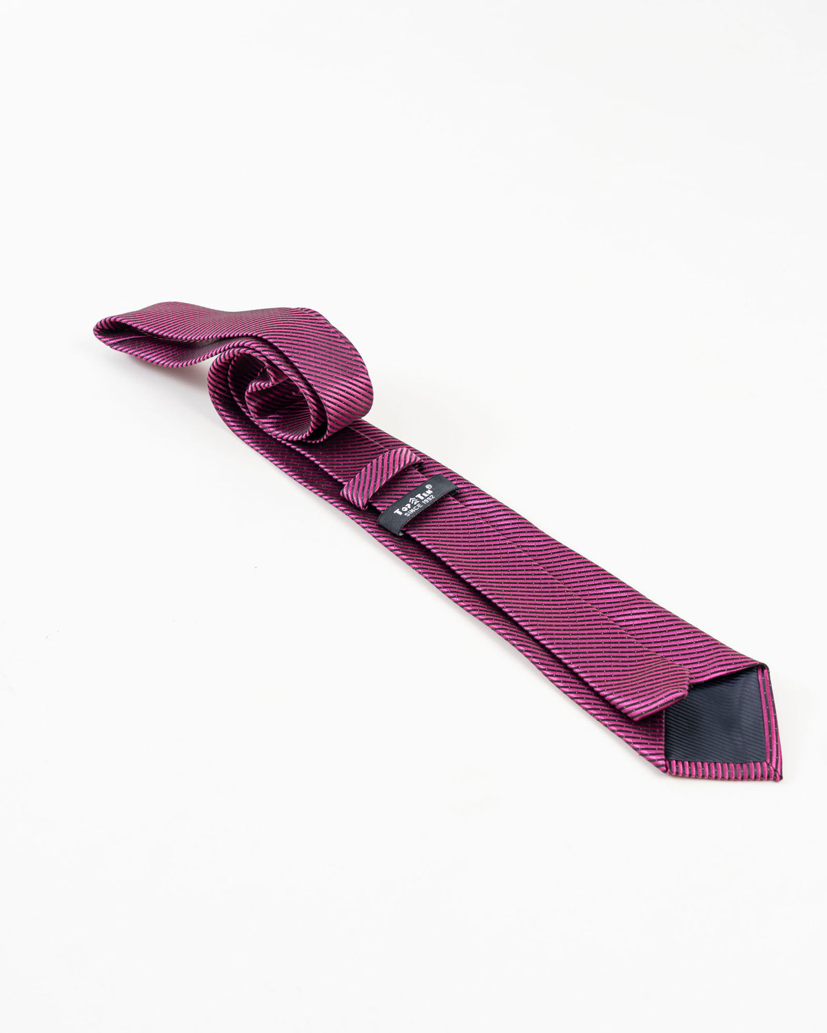 Reverse detail of pink and navy diagonal striped tie