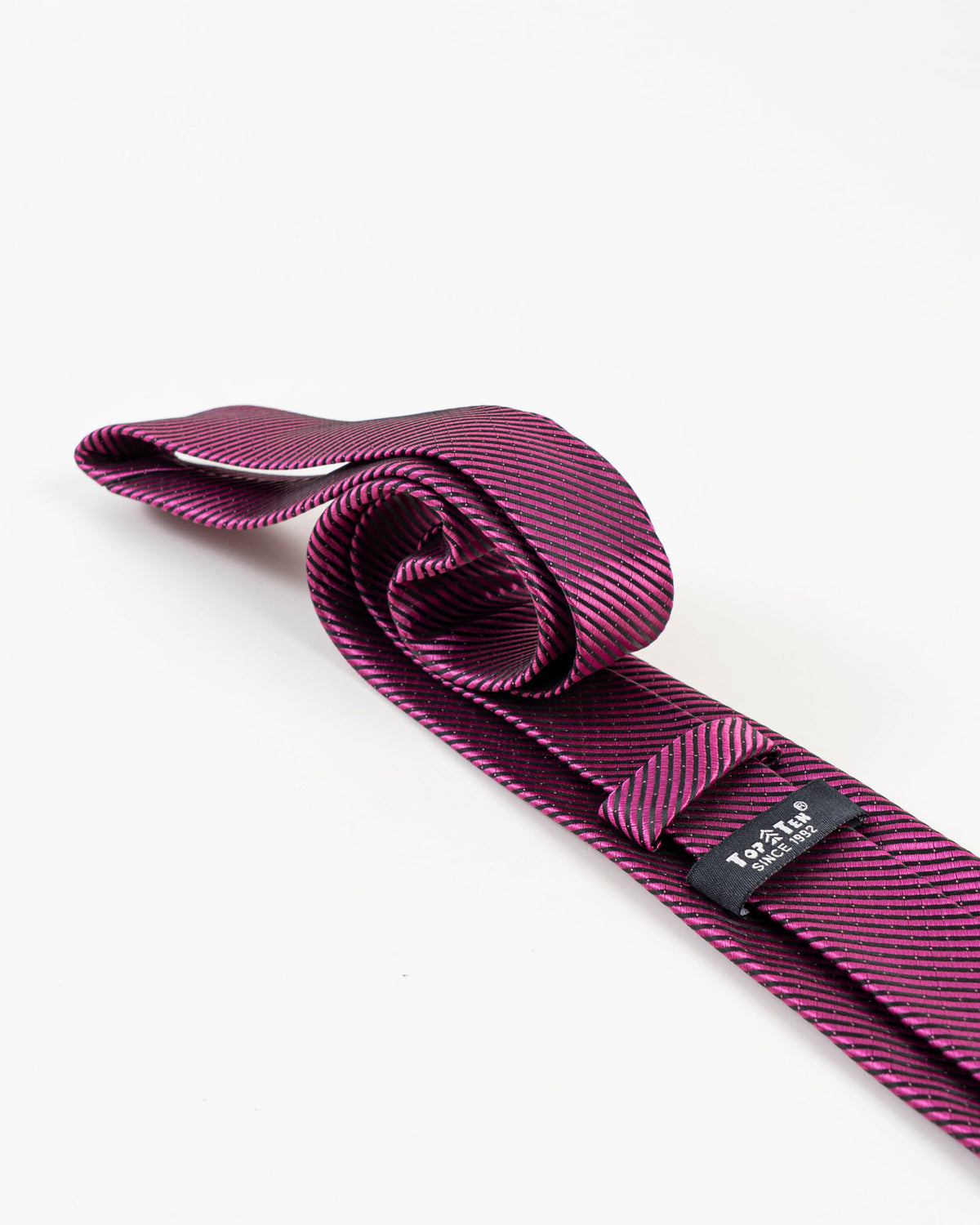 Full view of pink and navy diagonal striped tie