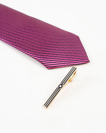 Black stripe gold-tone tie clip shown with a patterned tie