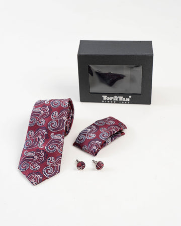 Close-up of burgundy paisley patterned tie
