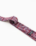 Reverse detail of burgundy paisley patterned tie