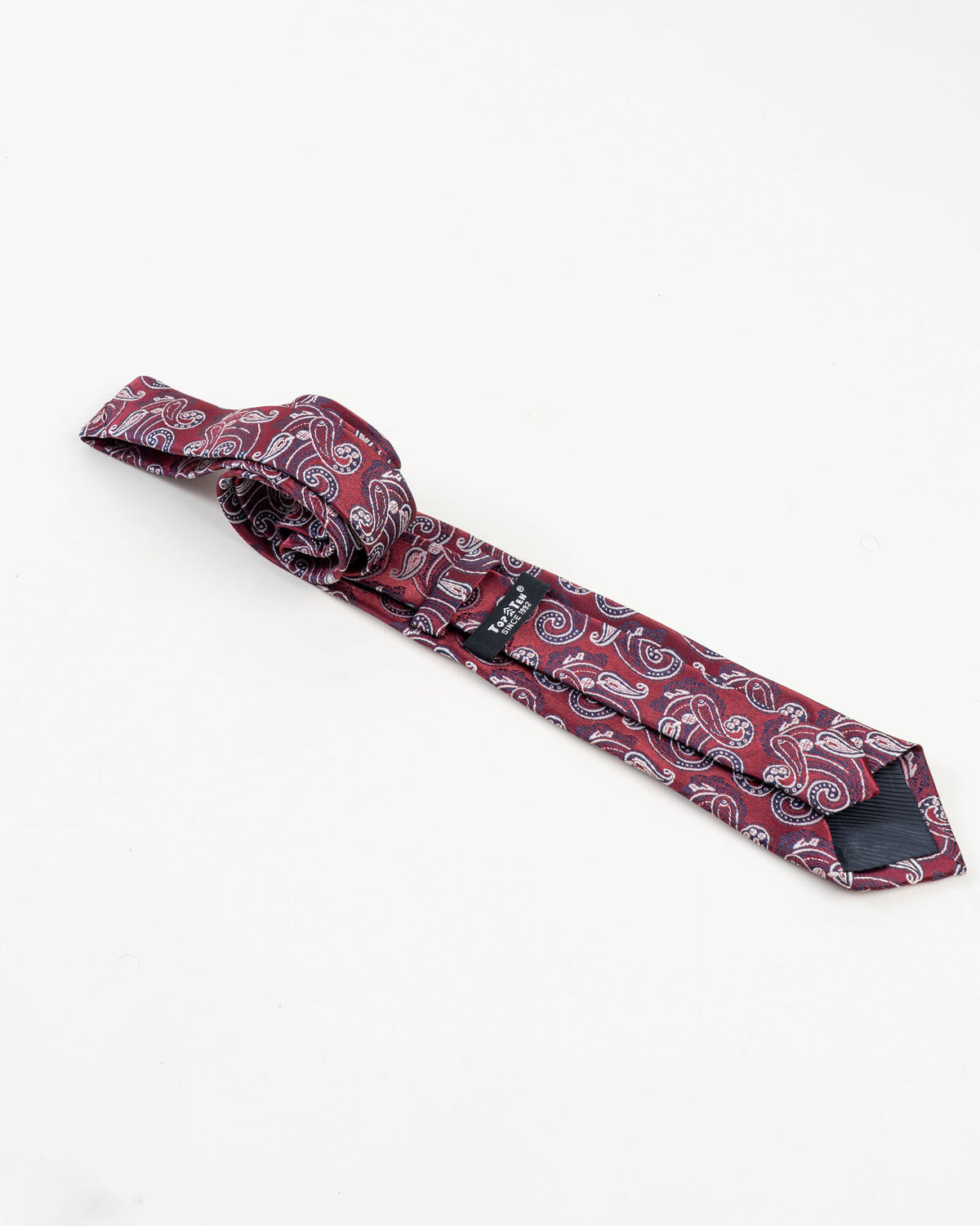 Full view of burgundy paisley patterned tie