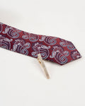 Diamond-textured gold-tone tie clip shown with a burgundy paisley tie