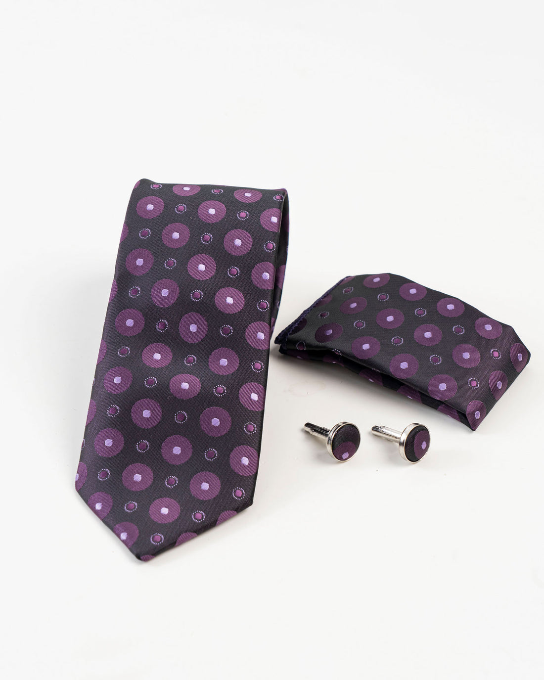Black and purple circular patterned tie set with matching accessories