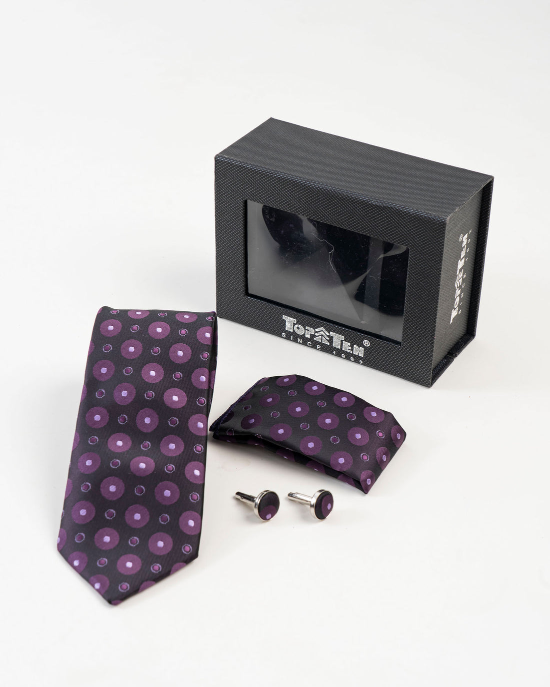 Black and purple circular patterned tie set with matching accessories