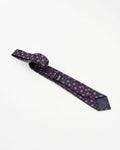 Black and purple circular patterned tie with matching pocket square