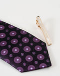 Classic gold-tone tie clip close-up