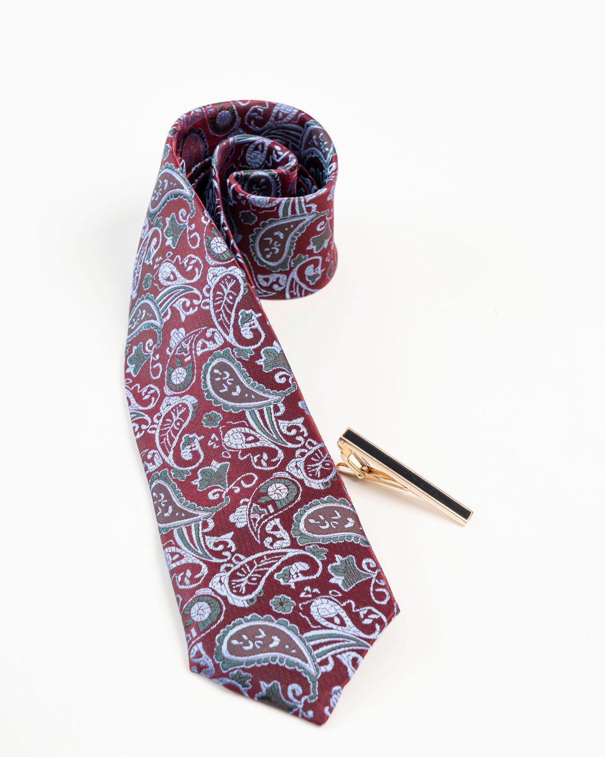 Black center gold-tone tie clip attached to a patterned formal tie