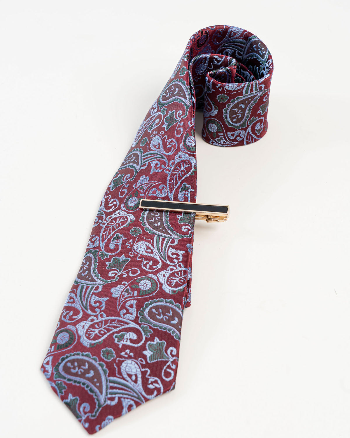 Black enamel-style tie clip shown with a burgundy paisley tie