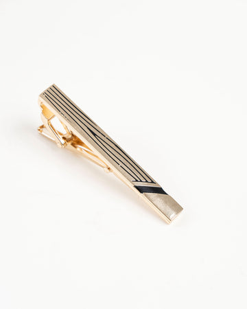 Black line gold-tone tie clip close-up