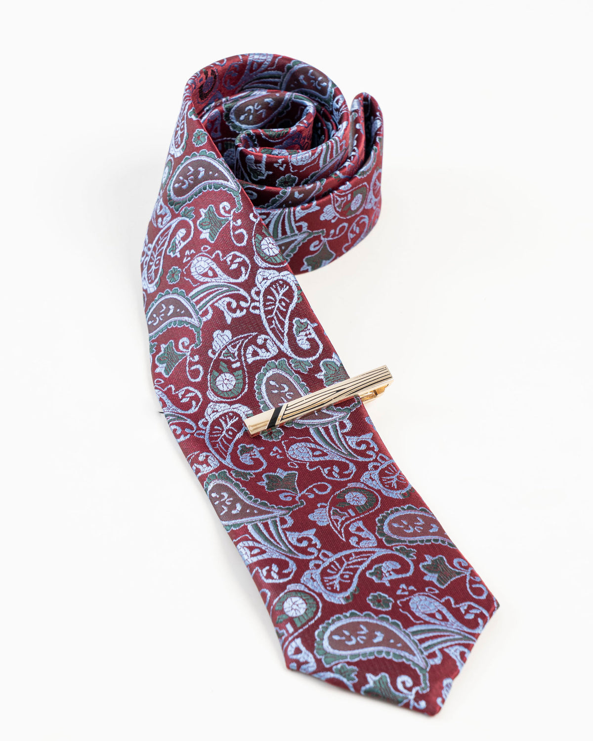 Multi-line gold-tone tie clip styled with a burgundy patterned tie